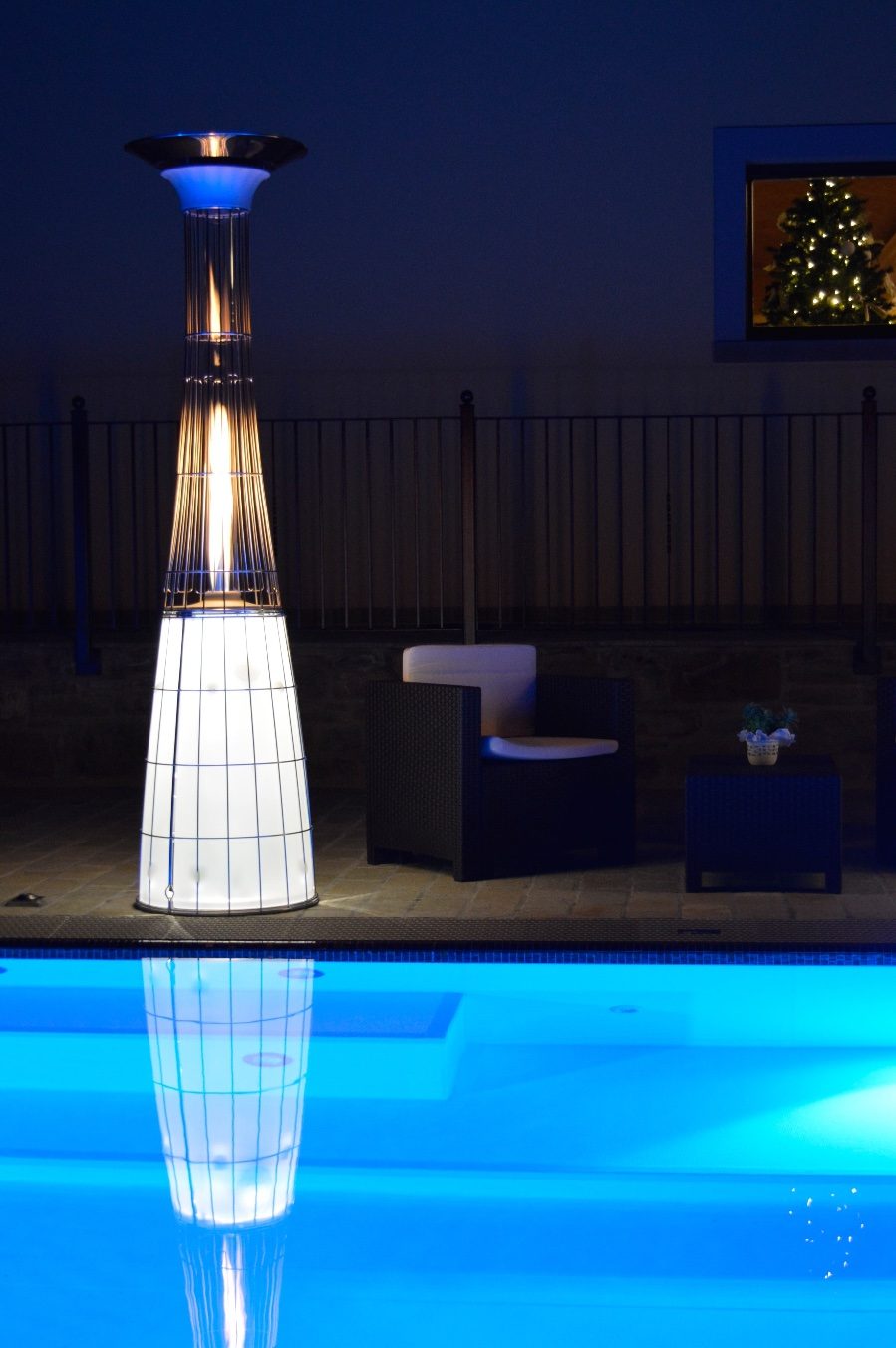 Italkero Dolce Vita tube heater glowing on a patio at night
