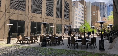 Commercial patio heaters installed over a restaurant patio